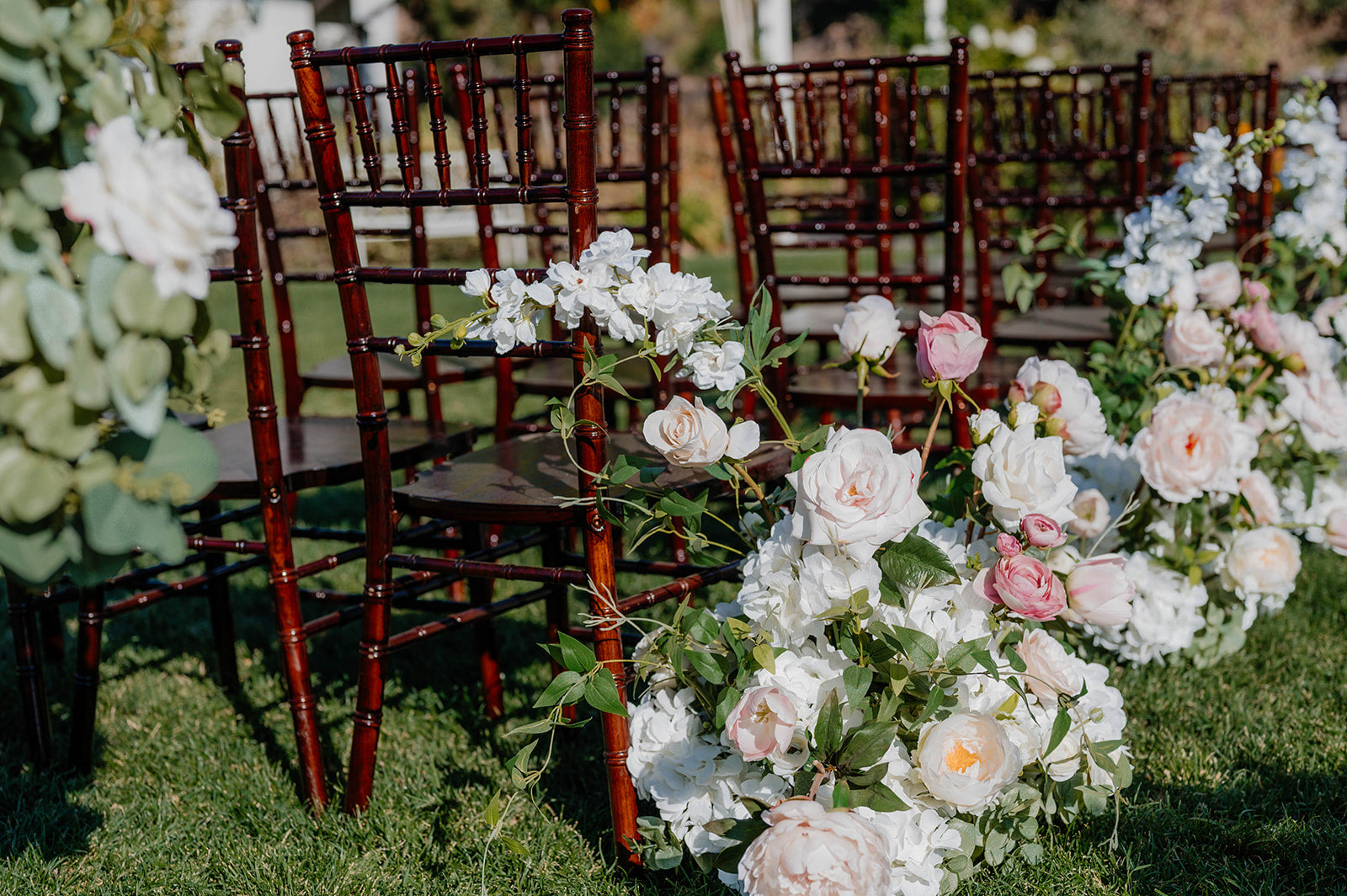 arch rental for wedding with blush pink aisle flowers